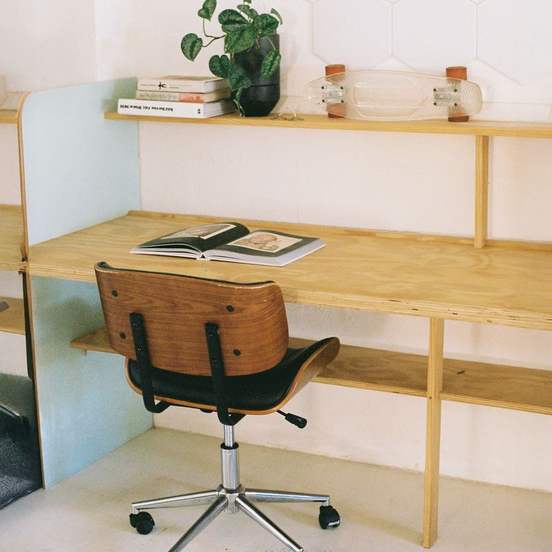 A plywood desk and shelves at Chalet Byron
